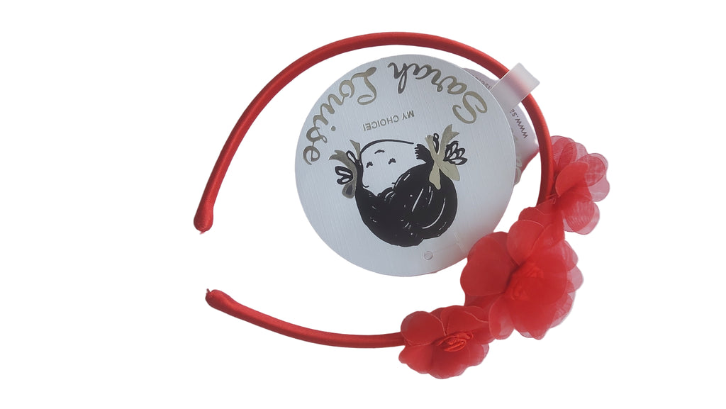 Red headband with floral decorations.