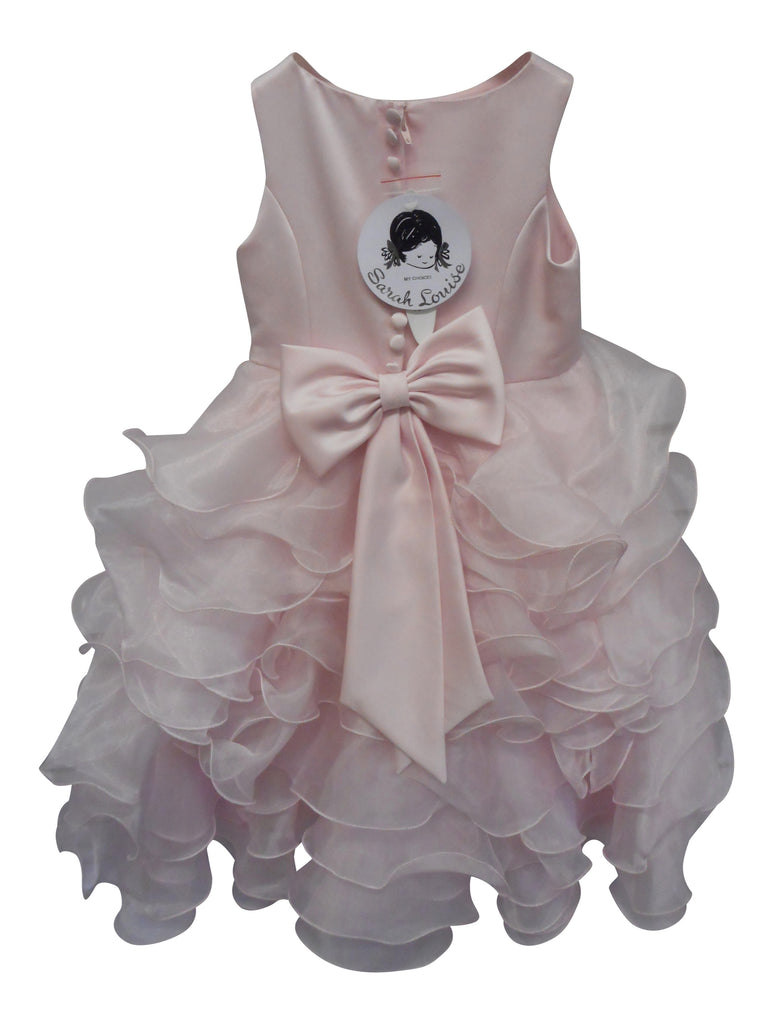 Pink ruffled dress with a large bow on a white background